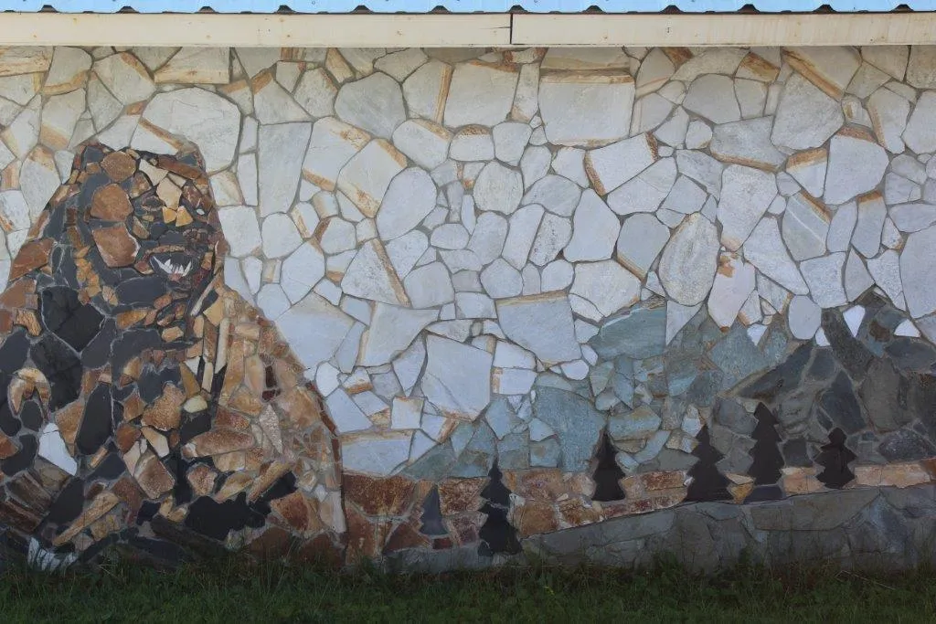 Stone mural of Salmo's historical roots