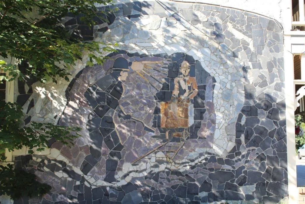 Stone mural of Salmo's historical roots